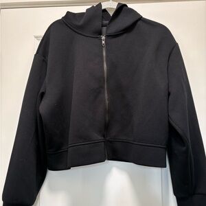 A New Day black zippered jacket with hood.